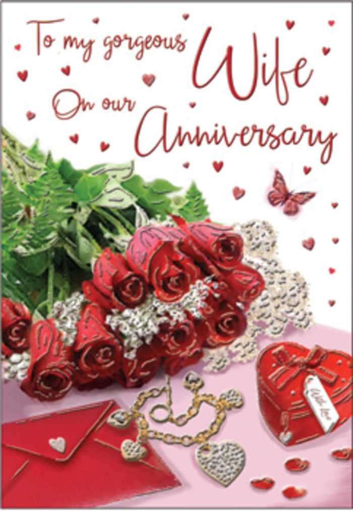 A richly detailed anniversary tableau unfolds as if set on a polished sideboard in a Thames Ditton home, where late-afternoon light falls gently across a carefully prepared surprise. At the centre is a bouquet of classic red roses, each bloom luxuriously full and rounded, their tightly layered petals creating a sense of depth and softness. The roses are wrapped or clustered in a way that feels both refined and generous, set off by lush green foliage that arcs around them, echoing the greenery of nearby parks and gardens such as those by the river or around Weston Green. The colour palette leans confidently into deep, romantic reds contrasted with soothing greens, a combination that feels timeless and reassuring. Around the flowers are delicate details that speak of shared history: a jewellery set with subtle gleams of gold or silver, and a vivid red box suggesting a treasured gift chosen with care. Whisper-thin lace and scattered heart designs soften the scene, folding in a sense of nostalgia and tenderness, as if recalling many anniversaries before this one. The anniversary card, lying close to the bouquet, bears a scripted message that curves gracefully across its front, the lettering catching soft highlights that guide the eye. Textures layer together in a satisfying harmony: the plush petals of the roses, the crisp yet silky paper of the card, the cool firmness of metal and polished surfaces, and the faint suggestion of velvet or satin ribbon. The lighting is calm and enveloping, creating gentle shadows that emphasise the arrangement's depth while maintaining an inviting warmth. It feels like a visual embrace-a quiet yet powerful expression of love that honours not just a single anniversary, but all the shared days and milestones that led to this one in Thames Ditton.